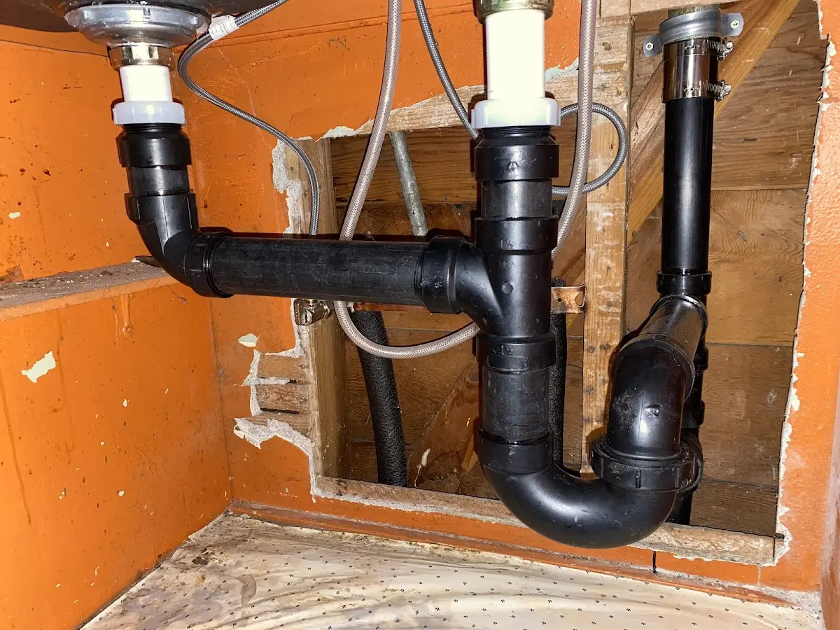 Professional Garbage Disposal Repair equipment and tools on the job in Ashby